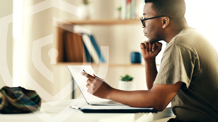 man at a computer thinking of how to safeguard his computer network