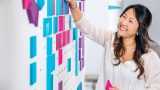Woman working on whiteboard